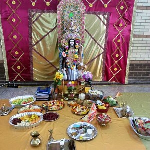 Yellow Saris and Haathe Khori at Puja for the Goddess of Learning