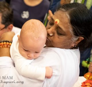 Mata Amritanandamayi Devi (Amma) embraces Atlanta
