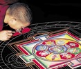 Students create sand mandalas