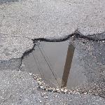 THE PERSISTENT PROBLEM OF POTHOLES